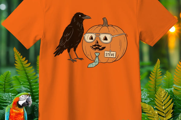 Orange t-shirt with a crow and a pumpkin named Steve wearing glasses and a tie.