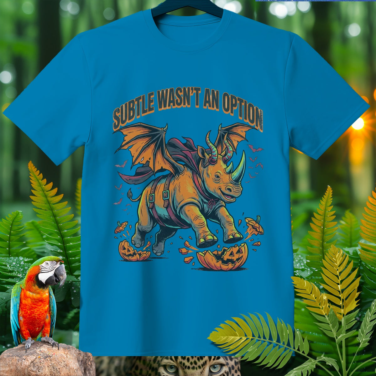 Blue t-shirt with a winged rhino crushing a jack-o'-lantern. "Subtle wasn't an option."