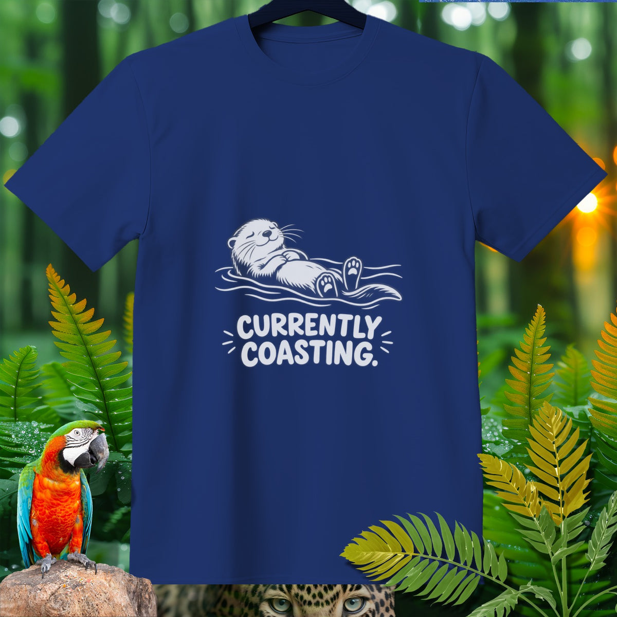Navy t-shirt with white graphic of otter floating and text "CURRENTLY COASTING."