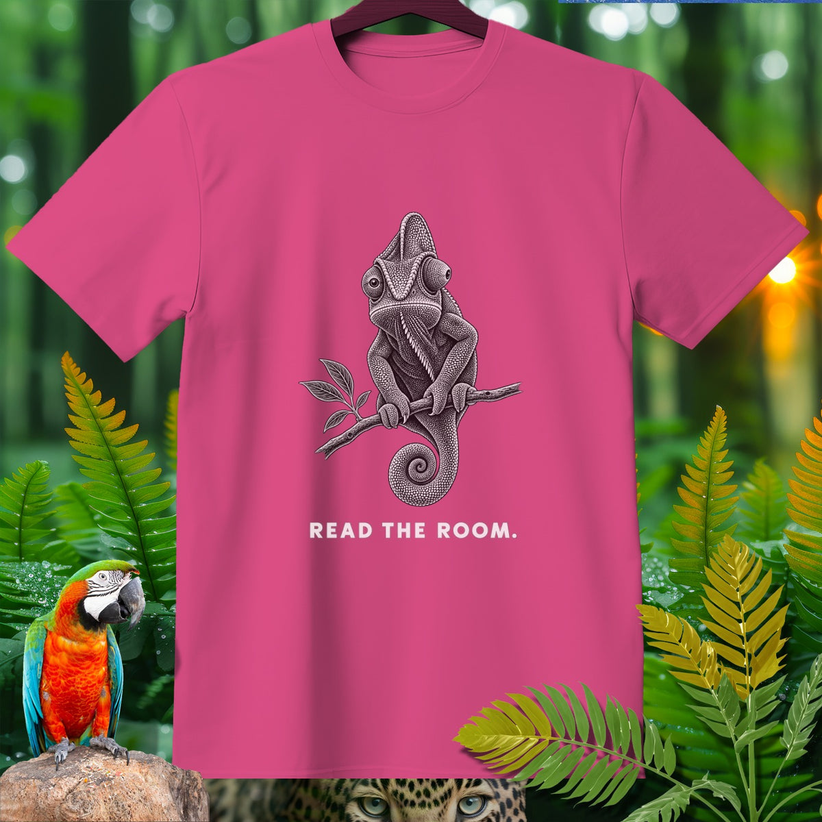 Pink t-shirt with a chameleon graphic and text "READ THE ROOM."