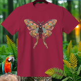 Maroon t-shirt with a skeletal luna moth graphic with celestial patterns.