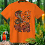 Orange t-shirt with a Halloween cobra, candy, and 