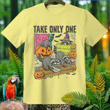 Yellow t-shirt with raccoons and pumpkins, text reads 