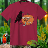 A crow stands next to a pumpkin wearing glasses, mustache, and a tie labeled STEVE.