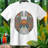 White t-shirt with colorful mandala featuring jack-o'-lantern, skulls, snakes, and eyes.