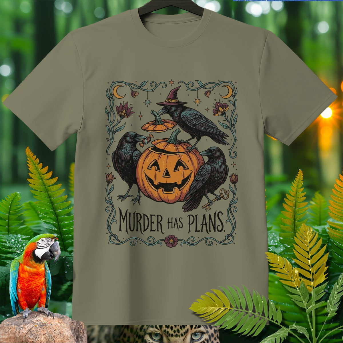 T-shirt graphic with crows, a jack-o'-lantern, and text "Murder Has Plans".