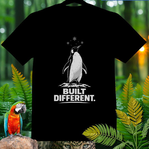Black t-shirt with a penguin graphic and "BUILT DIFFERENT." text.