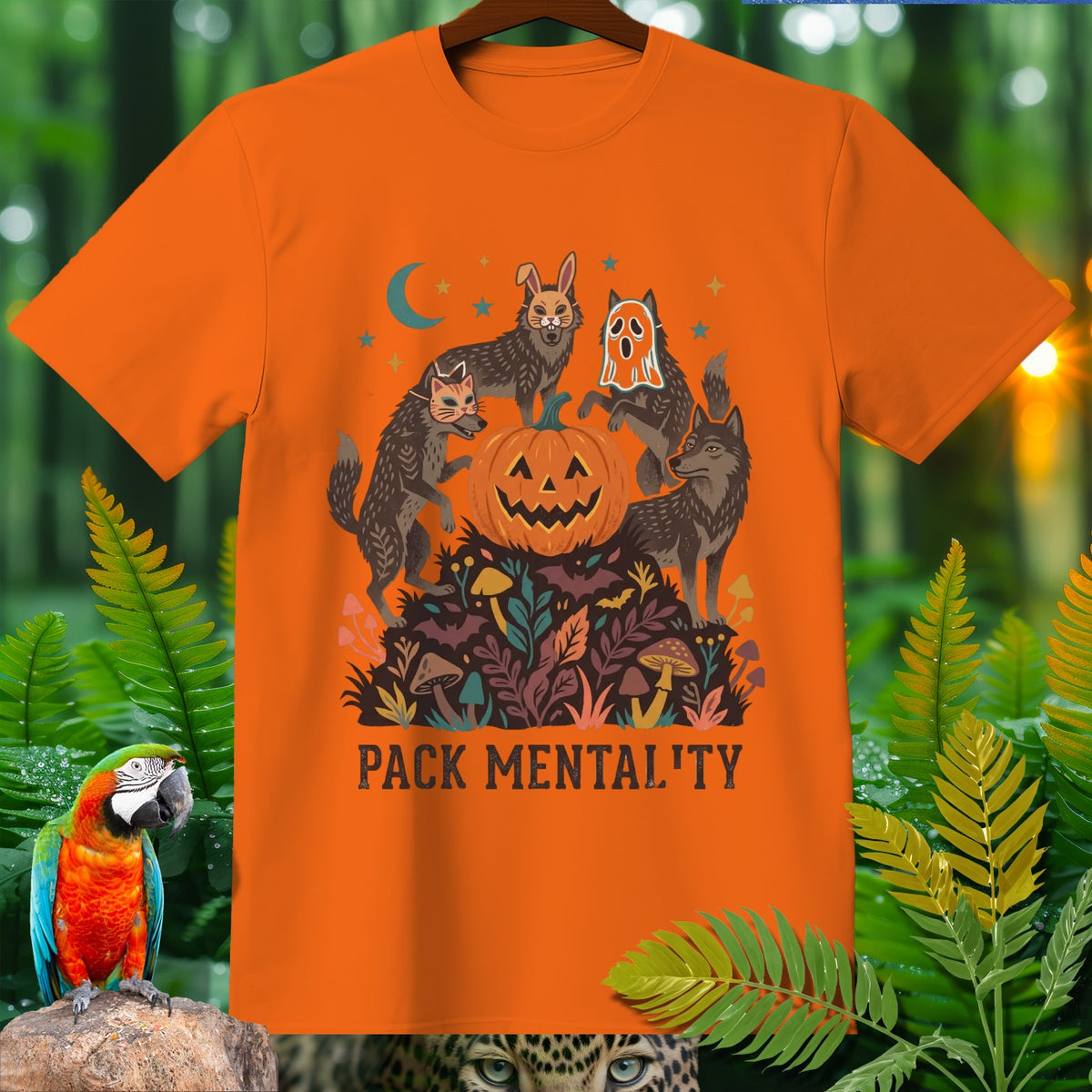 Orange t-shirt with wolves, jack-o'-lantern, and text "PACK MENTALITY".