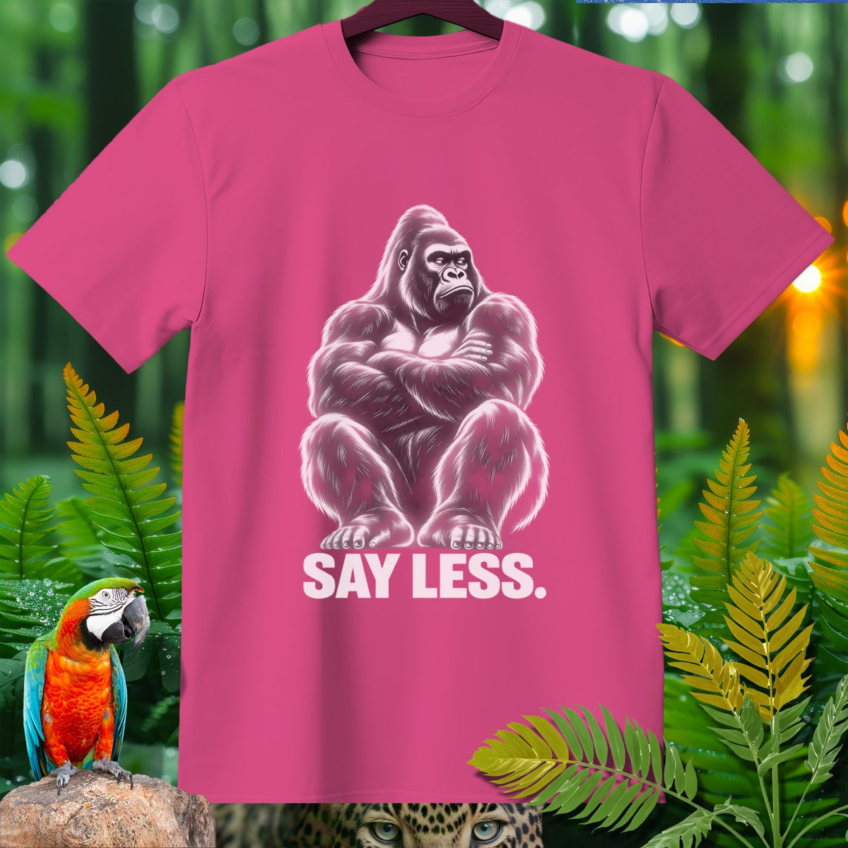 Pink t-shirt with a gorilla illustration and the text "SAY LESS."