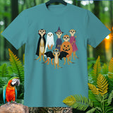 Meerkats dressed in Halloween costumes including vampire, ghost, witch, fairy, and pumpkin.