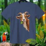 Blue t-shirt with a cartoon goat eating a leaf and jungle foliage.