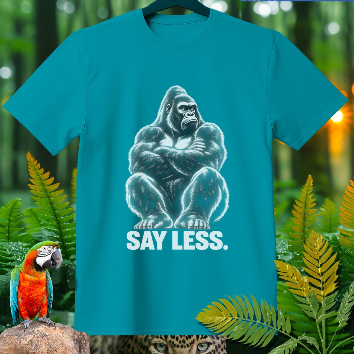 Teal t-shirt with a white graphic of a gorilla and the text "SAY LESS."