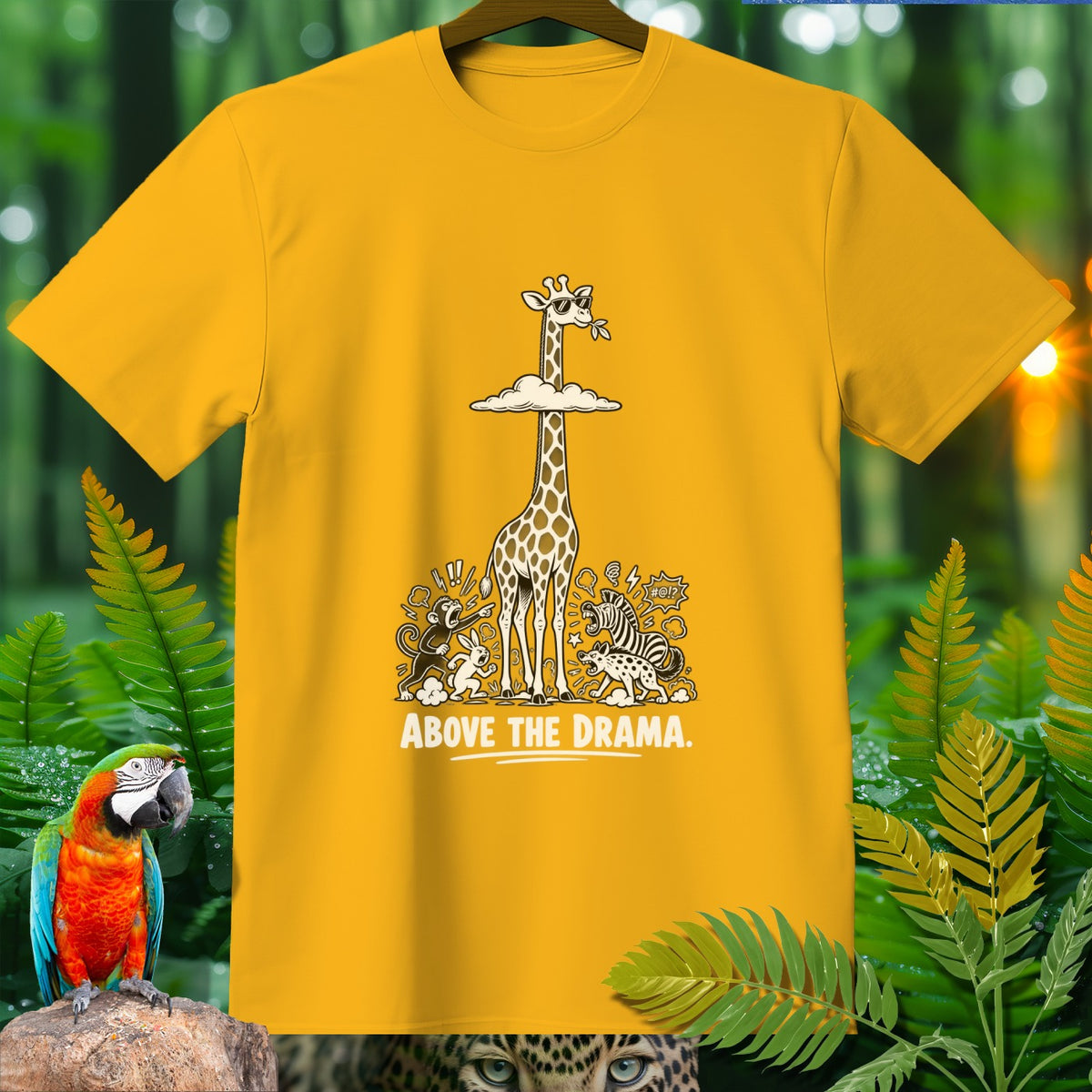 Yellow t-shirt with cartoon giraffe above other animals, text "ABOVE THE DRAMA."