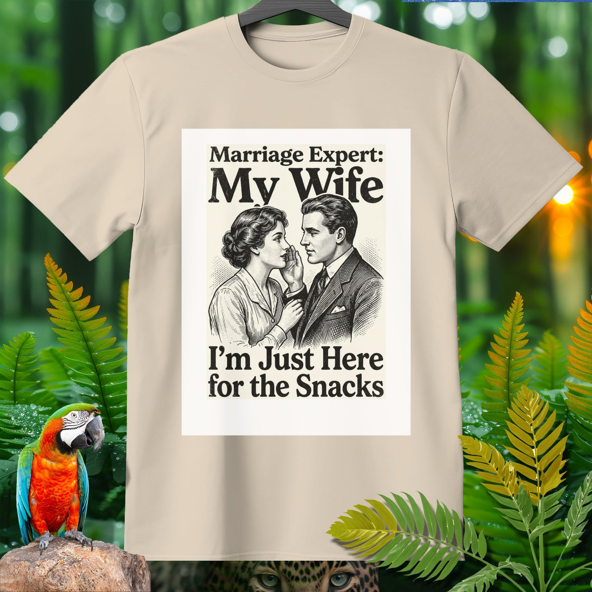 Beige t-shirt with sketch of couple and text "Marriage Expert: My Wife. I'm Just Here for the Snacks."