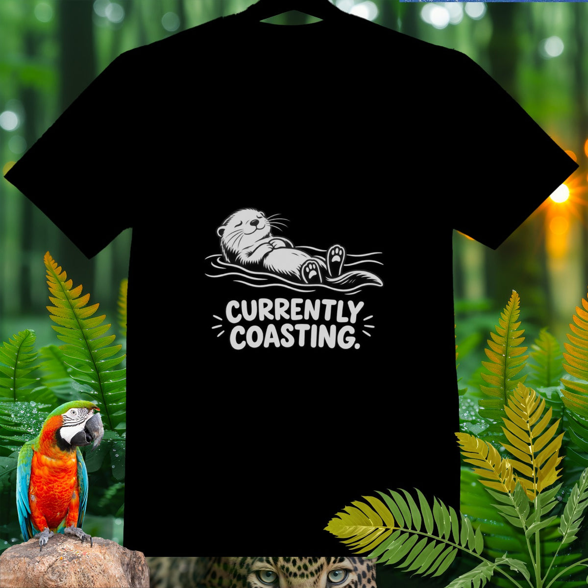 Black t-shirt with white graphic of a floating otter and text "CURRENTLY COASTING."