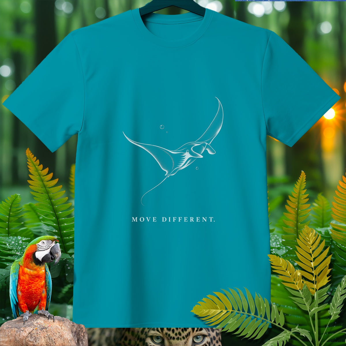 Teal t-shirt with white manta ray graphic and text "MOVE DIFFERENT."