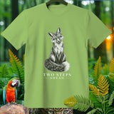 Light green t-shirt with a black and white fox illustration and text 