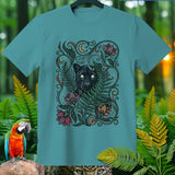 Teal t-shirt featuring a black panther illustration with floral and celestial elements.