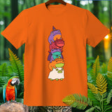Orange t-shirt with a stacked illustration of five cartoon frogs in Halloween costumes.