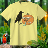 Yellow t-shirt with crow and a pumpkin wearing glasses and a tie named Steve.