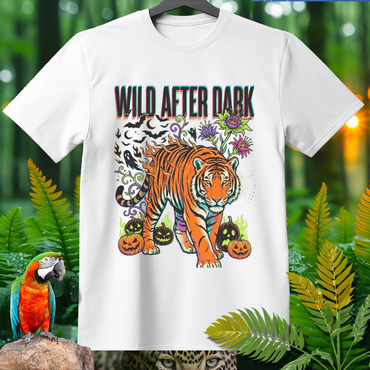 White t-shirt graphic with tiger, pumpkins, ghosts, bats, and text "WILD AFTER DARK".