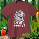 Maroon t-shirt with capybara drawing and text 