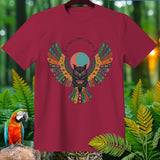 Maroon t-shirt with an owl graphic and Halloween-themed wings against a forest background.