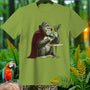 Gorilla in vampire cape sips coffee with a bat, on a green t-shirt.