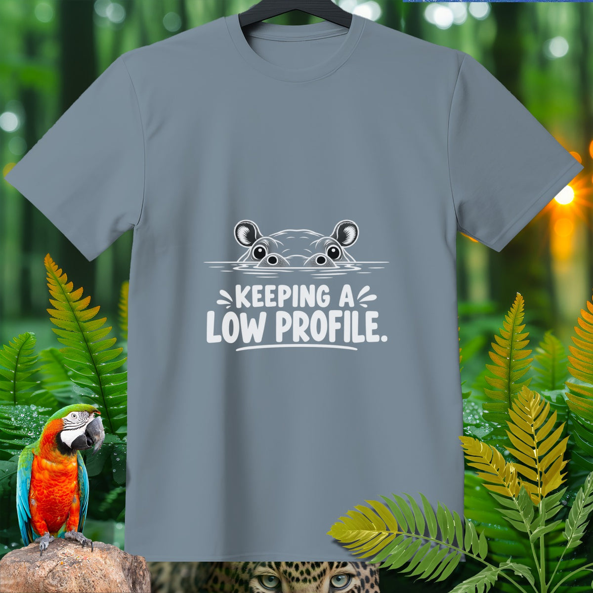 Grey t-shirt with cartoon hippo peeking from water and text "KEEPING A LOW PROFILE."