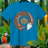 Teal t-shirt featuring a circular design of a fox, pumpkin, and ghost.