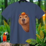 Navy blue t-shirt with capybara wearing an orange on its head.