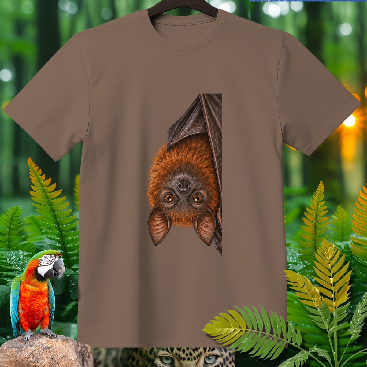 Brown t-shirt with a hanging bat graphic, surrounded by jungle foliage and a macaw.