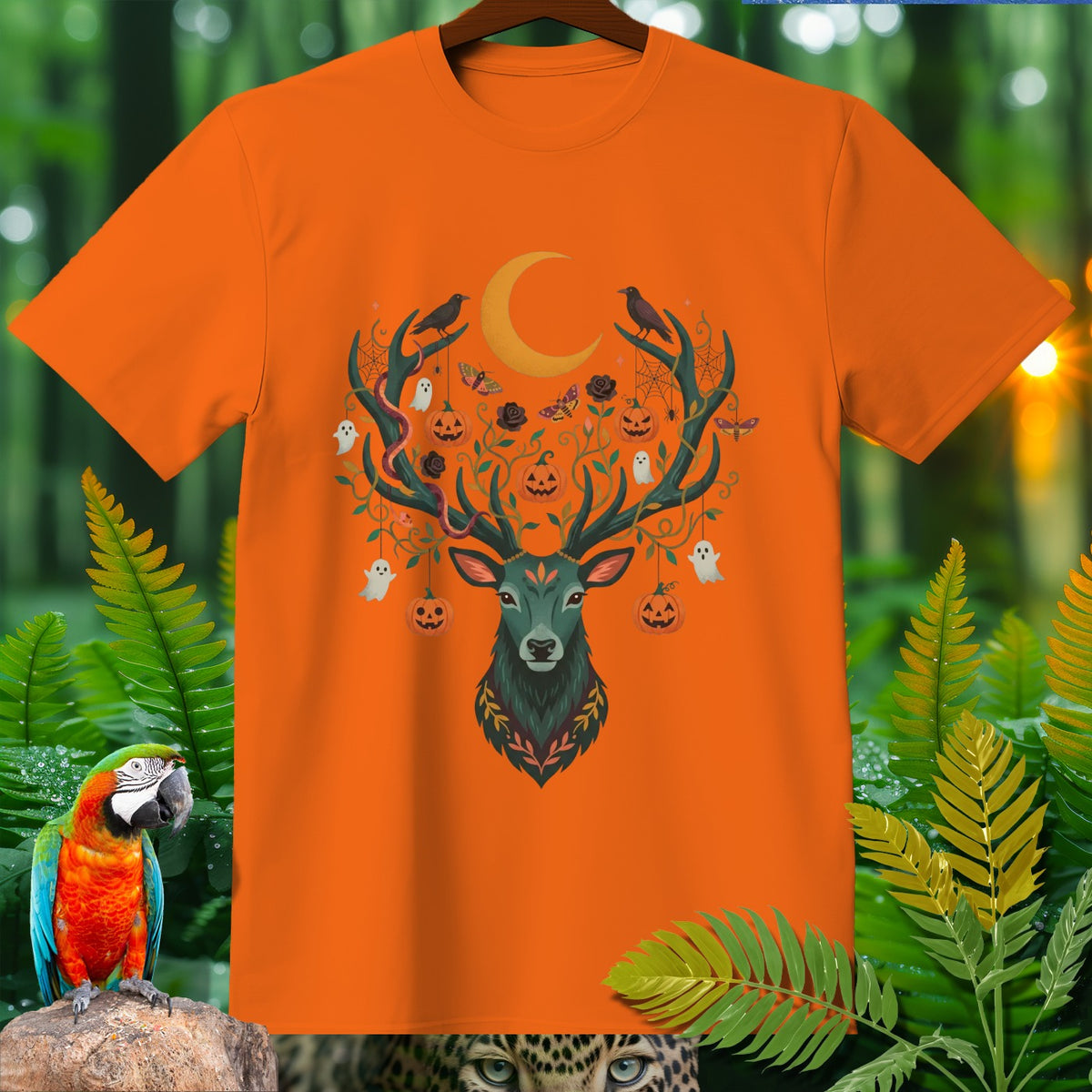 Orange t-shirt with Halloween deer graphic featuring pumpkins, ghosts, and a crescent moon.