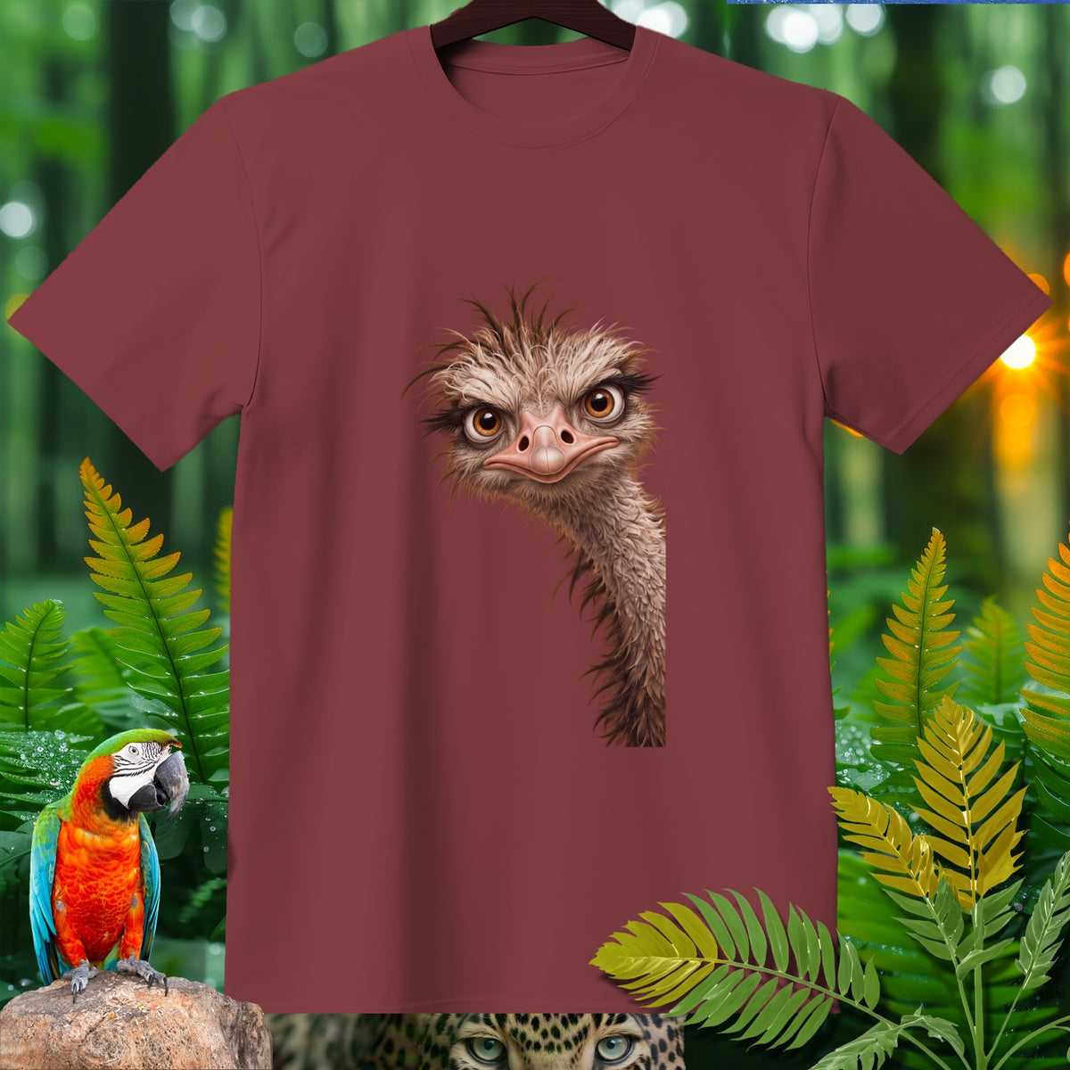 Maroon t-shirt with cartoon ostrich head design, surrounded by jungle foliage and a macaw.