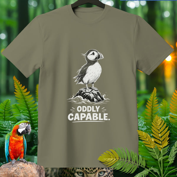 Puffin illustration on olive t-shirt reads "ODDLY CAPABLE."