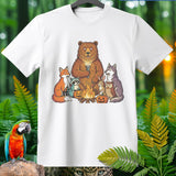 Cartoon animals around a campfire with pumpkins and a flashlight.