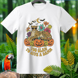 White t-shirt with a leopard on pumpkins, bats, moon, and text 