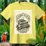 Yellow t-shirt with a black ink design of a slice of cake, candle, and text.