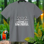 Gray t-shirt with a cartoon hippo peeking from water and text "KEEPING A LOW PROFILE."
