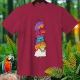 Maroon t-shirt with a stack of five cute, cartoon frogs in Halloween costumes.