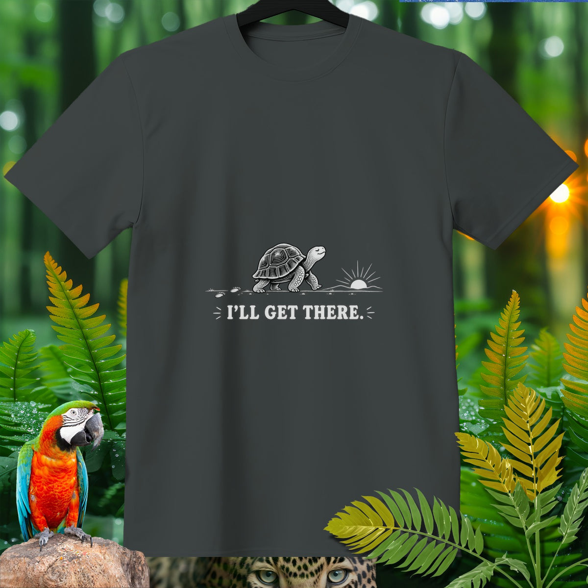 Dark grey t-shirt with a walking turtle graphic and the text "I'LL GET THERE."