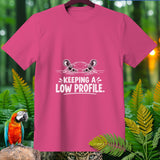 Pink t-shirt with a cartoon hippo peeking out of water saying 