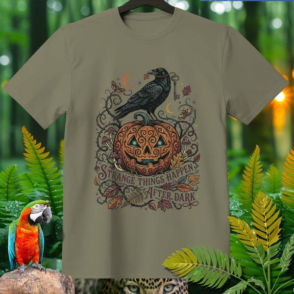 Halloween t-shirt with crow on pumpkin, says "Strange things happen after dark."