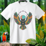 White t-shirt with an owl graphic featuring colorful, patterned wings and bats.