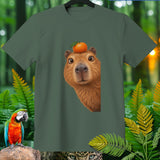 T-shirt with a capybara wearing an orange on its head and a parrot.