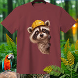 Maroon t-shirt with cartoon raccoon wearing a yellow hard hat peeking out.