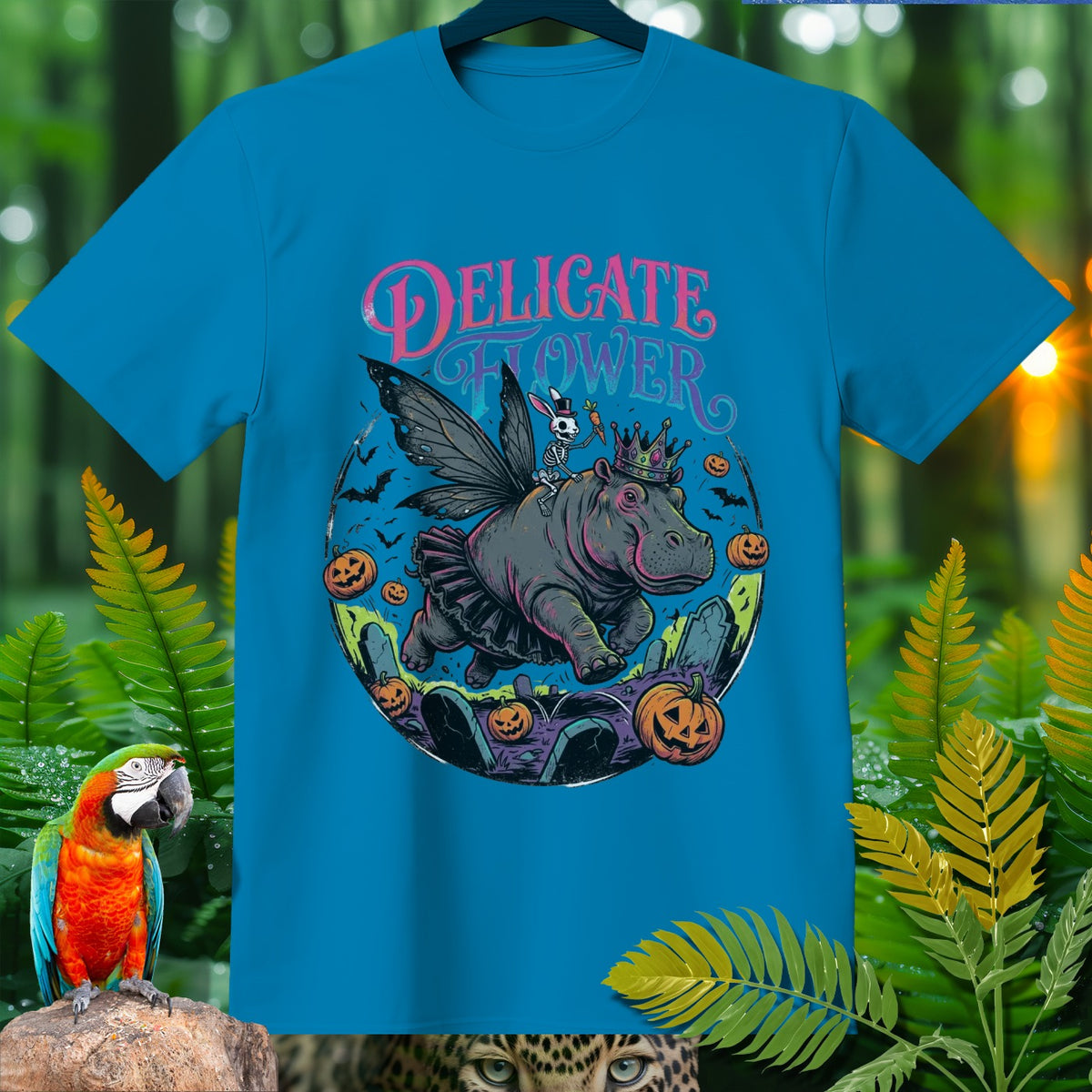 Teal t-shirt with "Delicate Flower" text and a fairy hippo illustration.