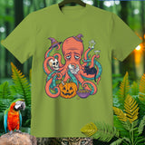 Green t-shirt with a sad octopus wearing a witch hat and surrounded by Halloween items.