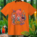 Orange t-shirt with sad octopus and Halloween icons: skull, cat, pumpkin, ghost.