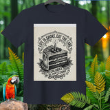 Dark blue t-shirt with a black and white illustration of a slice of cake and text.